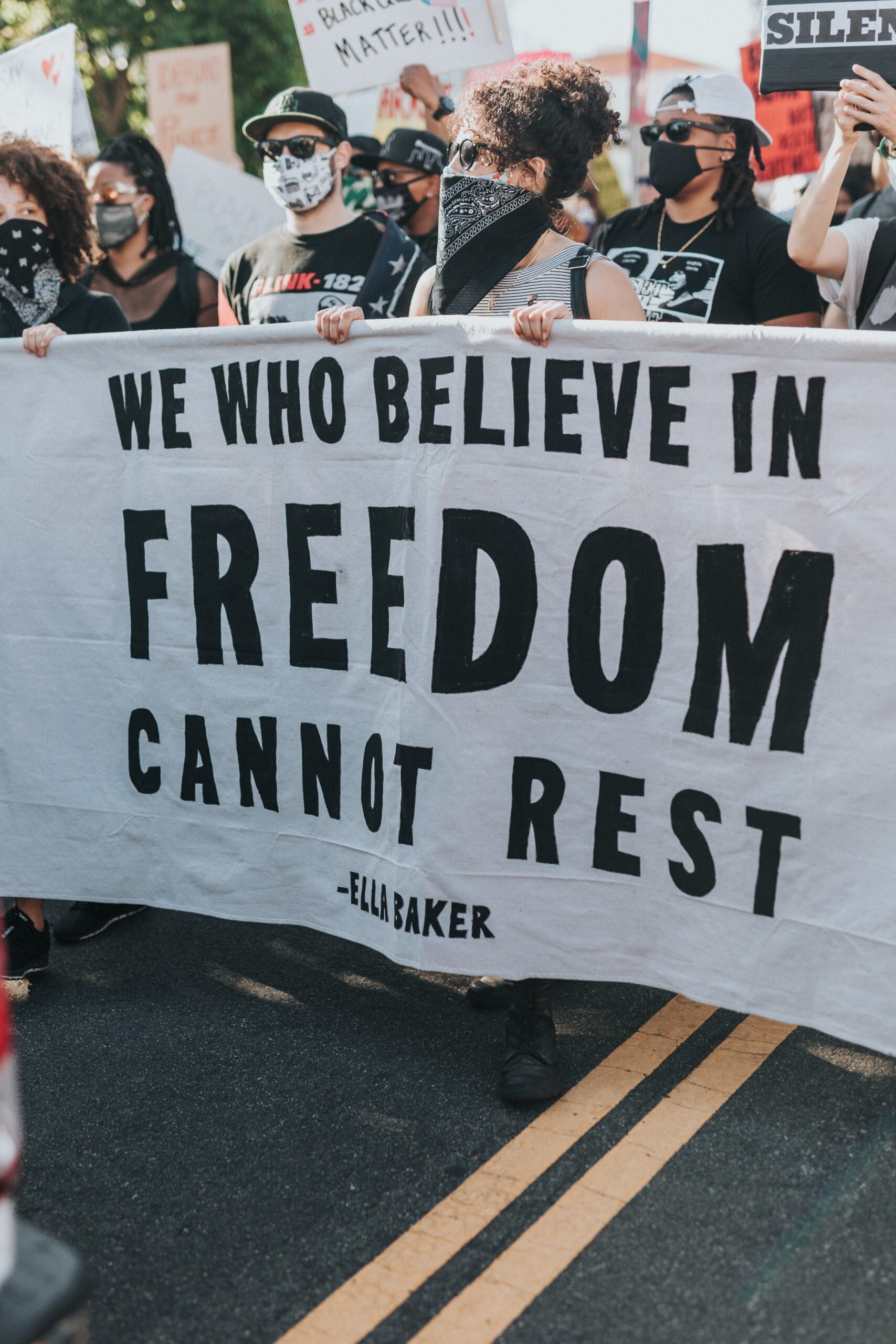 sign with ella baker quote at protest