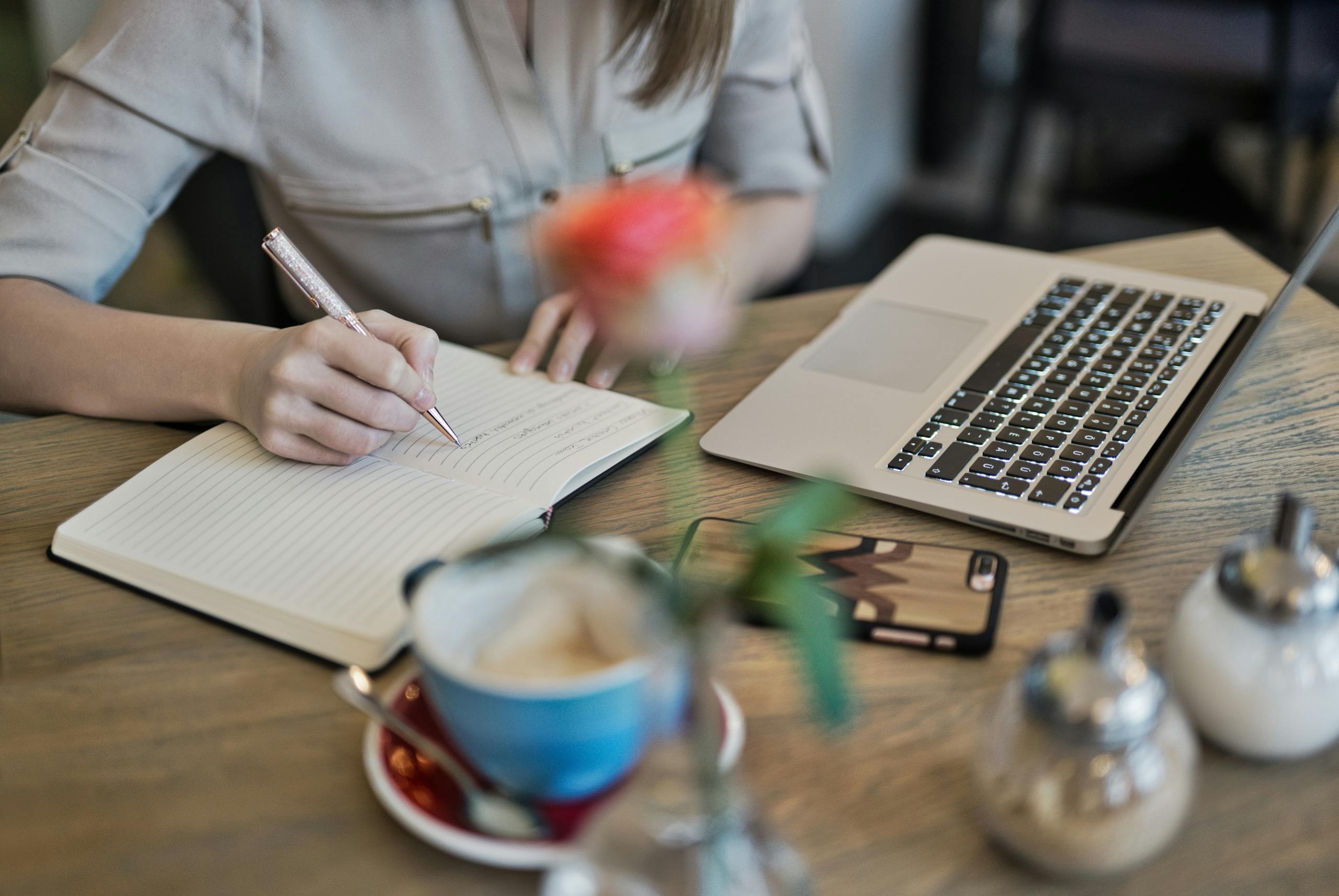 Woman writing a strategic plan for her organization